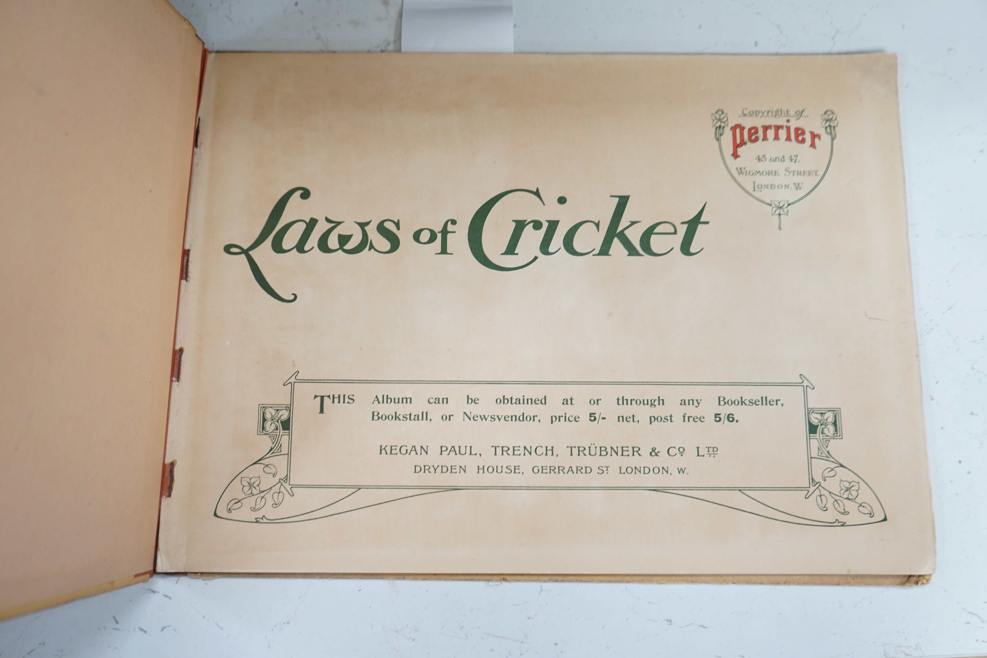 Crombie, Charles, The Laws of Cricket, 1907, 12 coloured plates (with captioned text) and coloured pictorial advert. leaf; original cloth-backed pictorial boards, oblong 4to. Kegan Paul, (1905)